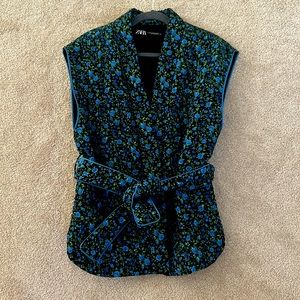 A sweet, floral, quilted tie waist vest